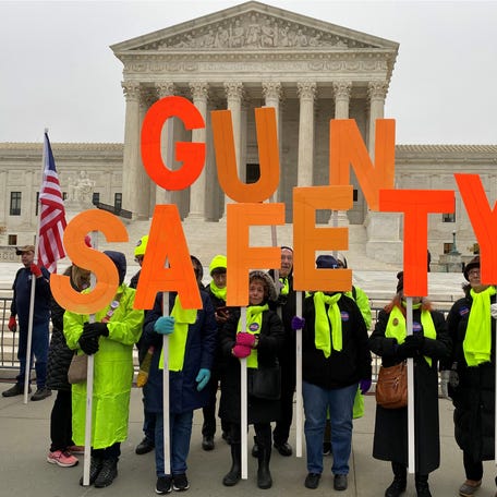 A group among hundreds of supporters of gun control laws rally in front of the US Supreme Court as the justices hear a major gun rights case on December 2, 2019.