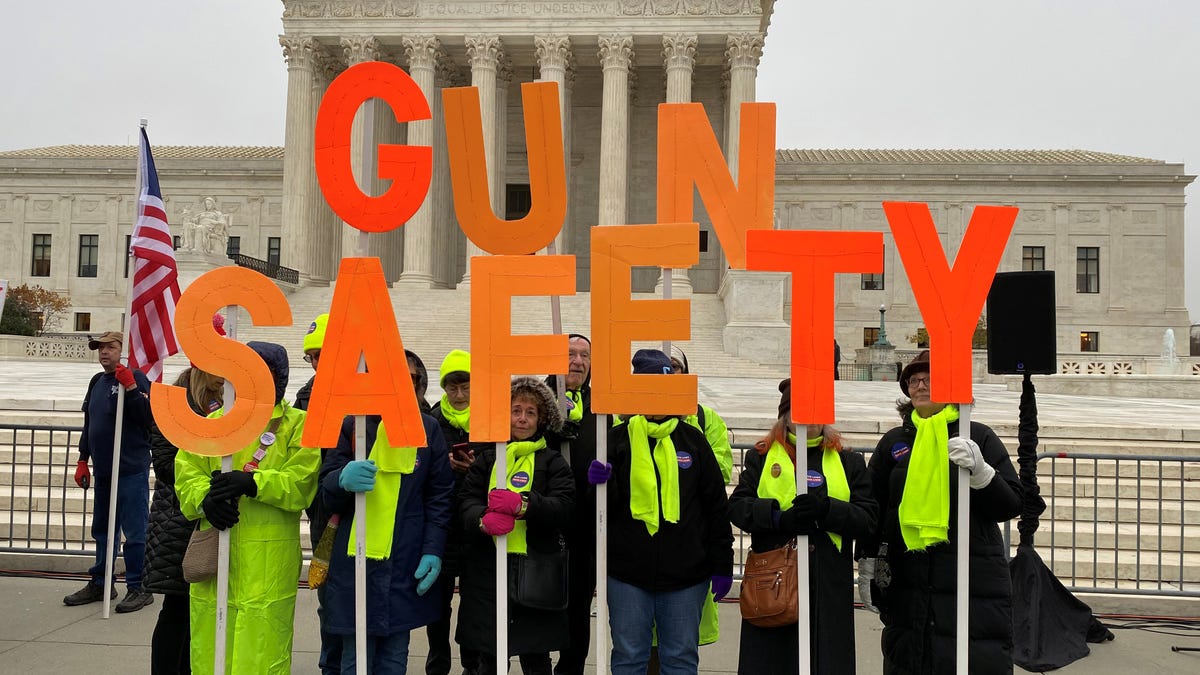 A group among hundreds of supporters of gun control laws rally in front of the US Supreme Court as the justices hear a major gun rights case on December 2, 2019.