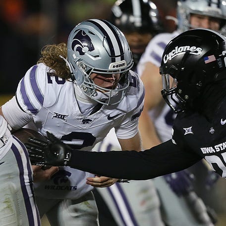 Iowa State Cyclones linebacker Will McLaughlin (23) attempts to tackle Kansas State Wildcats quarterback Avery Johnson (2) during the third quarter in the NCAA football at Jack Trice Stadium on Saturday, Nov. 30, 2024, in Ames, Iowa.