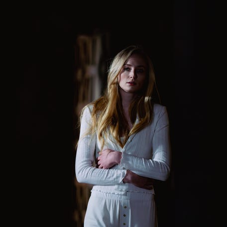 Lauren Lane (Sophie Turner) escapes to a remote cabin in the wake of a scandal, only to end up fighting for her life in the thriller "Trust."