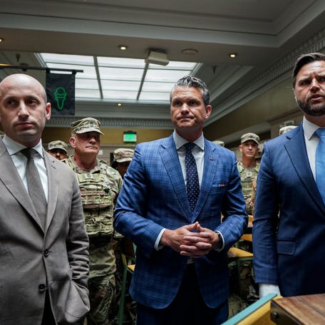 White House Deputy Chief of Staff Stephen Miller, Defense Secretary Pete Hegseth, and Vice President JD Vance speak with members of the National Guard during a visit to Union Station on August 20, 2025 in Washington, D.C.