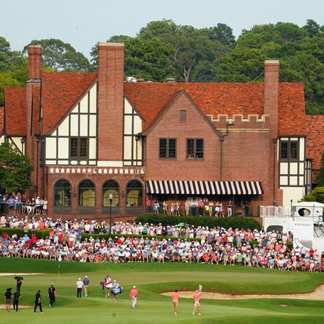 Keegan Bradley and Collin Morikawa walk up onto the 18th green during the final round of the 2023 Tour Championship golf tournament at East Lake Golf Club on August 27, 2023.