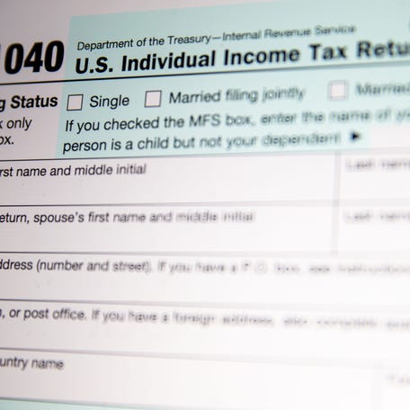 A 1040 tax form is pictured, the 2025 tax deadline is set to be on April 15, 2025.