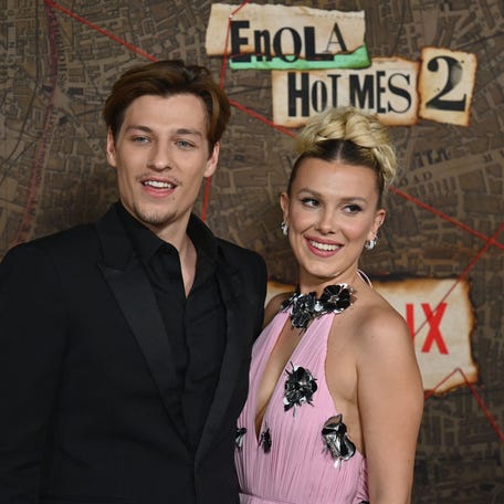 Jake Bongiovi and Millie Bobby Brown attend the premiere of "Enola Holmes 2" on Oct. 27, 2022.