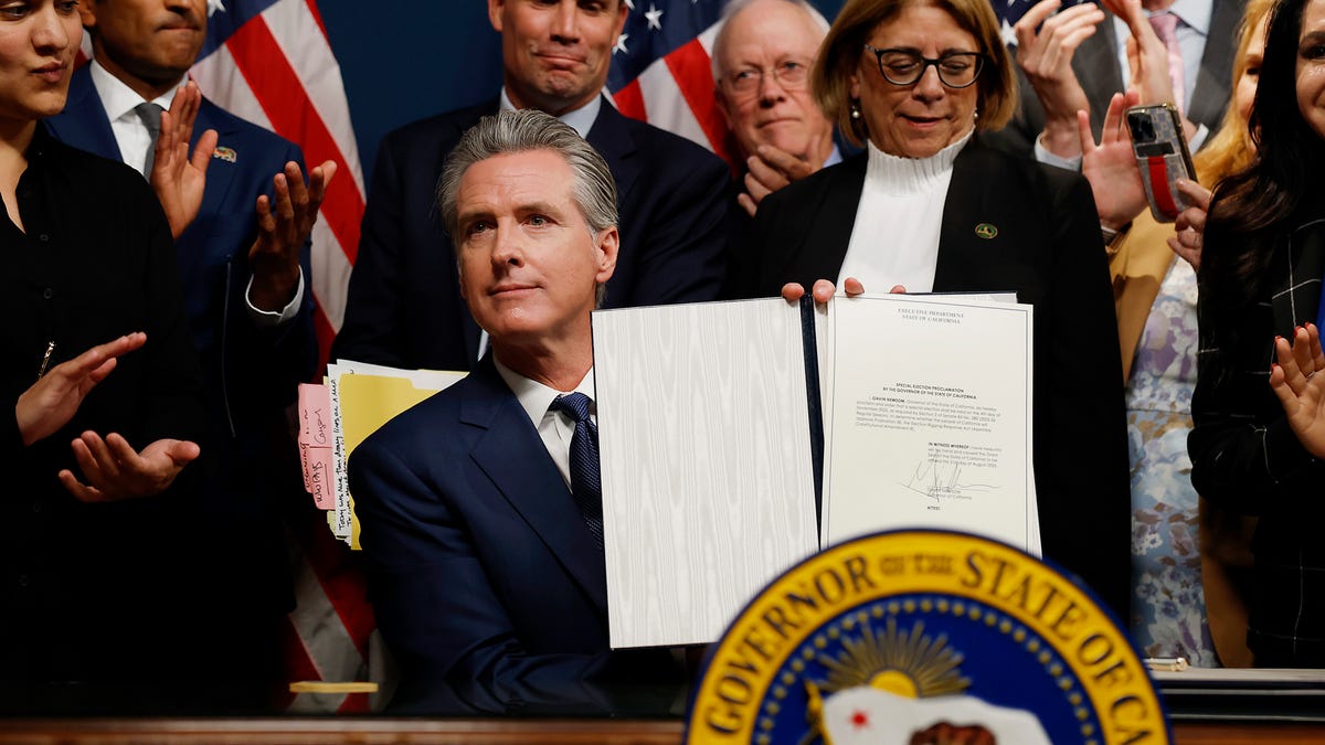 California Gov. Gavin Newsom signs bills related to redrawing the state's congressional maps in Sacramento, California, on Aug. 21.