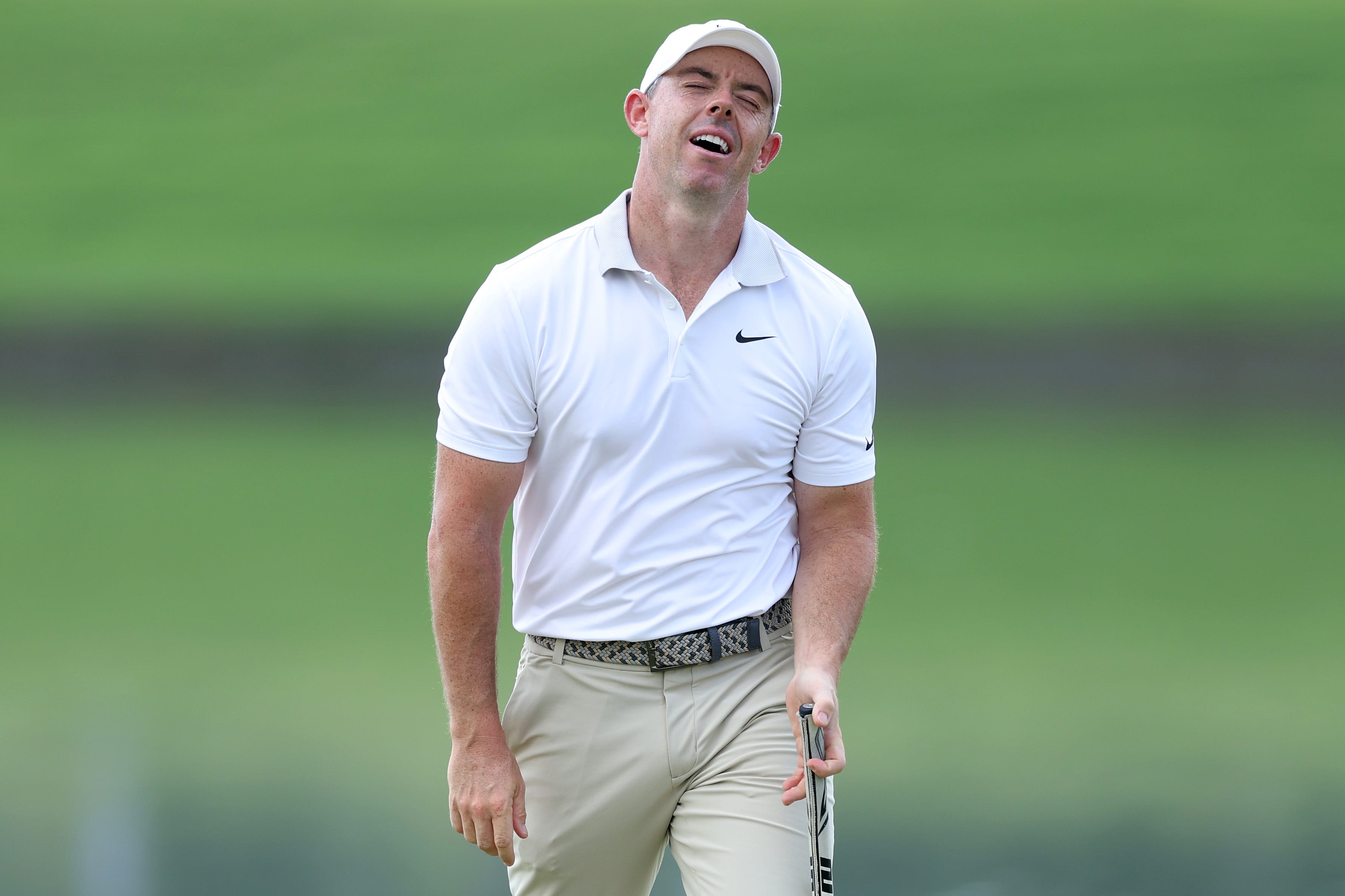 Rory McILroy pale a bunker shot and managed to sneak