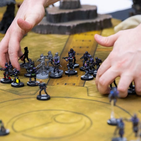 A player moves pieces of the game Star Wars Legion, which is mostly made in China, at Game Kastle in College Park, Maryland, July 24, 2025.