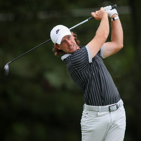 Tommy Fleetwood plays his shot from the third tee during the second round of the Tour Championship. He's tied for the lead with Russell Henley.