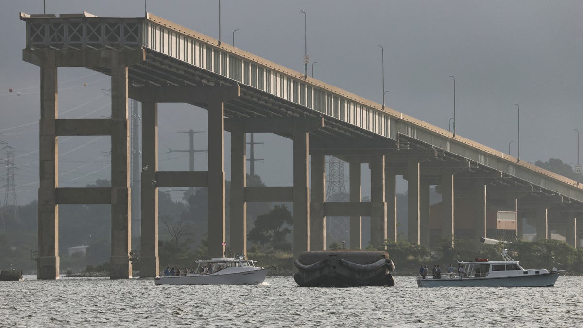 Water vessels are seen near the remaining part of Baltimore's collapsed Key Bridge, where work is expected to begin this week on the demolition of the bridge in Baltimore, Maryland, U.S., on July 7, 2025. REUTERS/Jonathan Ernst