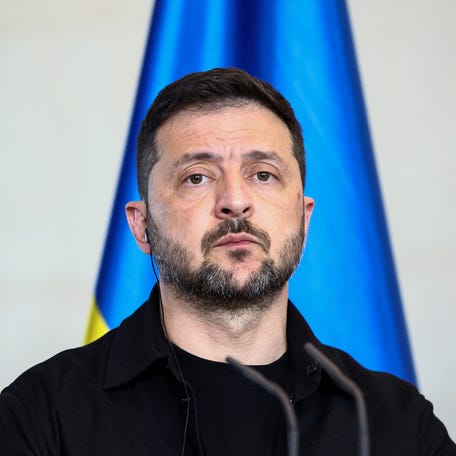 Ukrainian President Volodymyr Zelenskiy attends a press conference with German Chancellor Friedrich Merz (not pictured), on the day they attend a virtual meeting with U.S. President Donald Trump and European leaders on the upcoming Trump-Putin summit on Ukraine, in Berlin, Germany, August 13, 2025. REUTERS/Liesa Johannssen