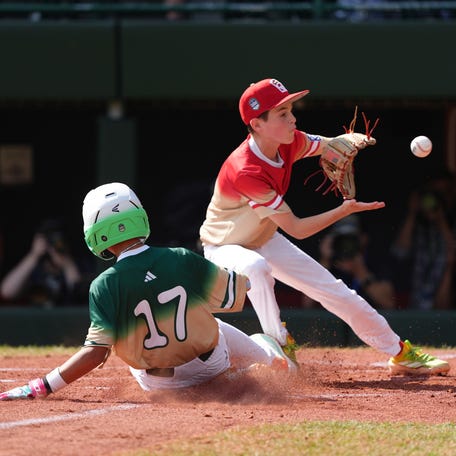 Aug 24, 2025; Williamsport, PA, USA; Jian Zih-De (17) of Asia-Pacific Region slides home to score against Luke D'Ambrosio (3) of Mountain Region in the second inning at Howard J. Lamade Stadium. Mandatory Credit: Kyle Ross-Imagn Images