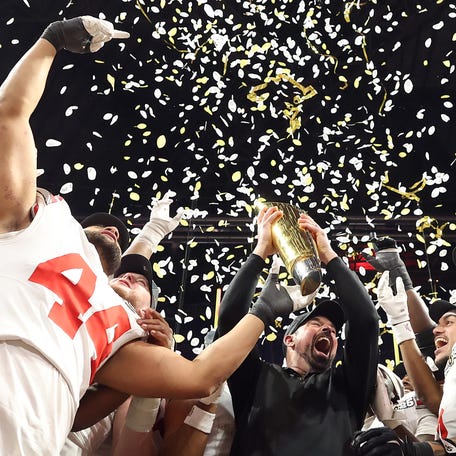 ATLANTA, GEORGIA - JANUARY 20: The Ohio State Buckeyes hoist the trophy after beating the Notre Dame Fighting Irish 34-23 in the 2025 CFP National Championship at the Mercedes-Benz Stadium on January 20, 2025 in Atlanta, Georgia. (Photo by Jamie Squire/Getty Images)