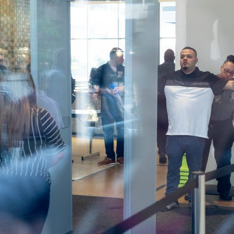 Kilmar Abrego Garcia goes through security as he arrives at a U.S. Immigration and Customs Enforcement (ICE) field office on August 25, 2025 in Baltimore, Maryland.