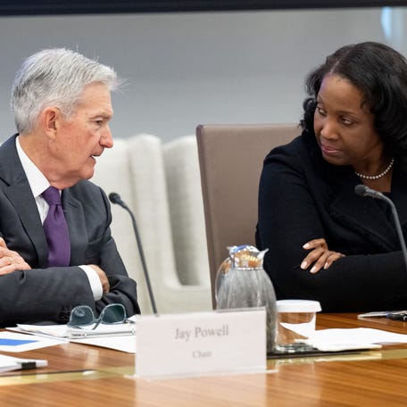 Chairman of the US Federal Reserve Jerome Powell speaks with Lisa Cook, member of the Board of Governors of the Federal Reserve, as he chairs a Federal Reserve Board open meeting discussing proposed revisions to the board's supplementary leverage ratio standards at the Federal Reserve Board building in Washington, DC, on June 25, 2025. (Photo by SAUL LOEB / AFP)