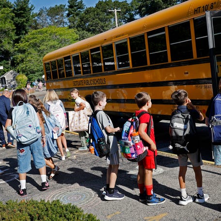 Kids gather in front of Cushing Elementary School in Scituate, waiting for the first bell on the first day of the new school year, Wednesday, Aug. 27, 2025.