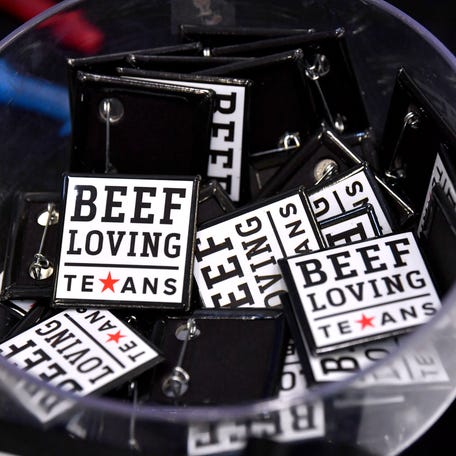 Promotional pins fill a bowl at the Big Country Beef Conference in the Taylor County Expo Center Thursday, Aug. 21, 2025.