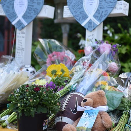 Mourners gather outside the Annunciation Church in Minneapolis on Aug. 28, 2025, after a 23-year-old opened fire during a back-to-school Mass, killing two students ages 8 and 10 and injuring 15 other children and three parishioners in their 80s.