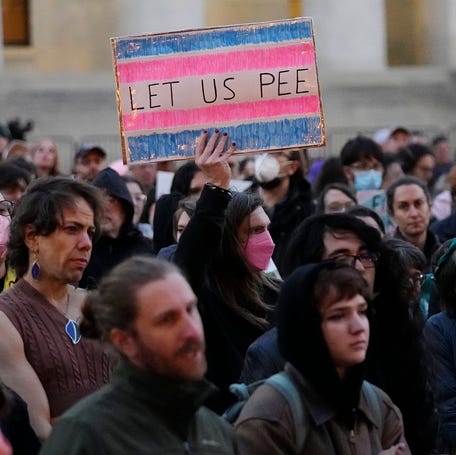 Transgender activists, advocacy groups and allies gather at the Ohio Statehouse in Columbus on Feb. 25, 2025, to protest the state's transgender bathroom bill.