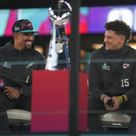 Kansas City Chiefs quarterback Patrick Mahomes, right, and Philadelphia Eagles quarterback Jalen Hurts, left, share the stage at the Footprint Center in downtown Phoenix during the NFL's Super Bowl opening night on Feb. 6, 2023.    Nfl Super Bowl Opening Night At Footprint Center