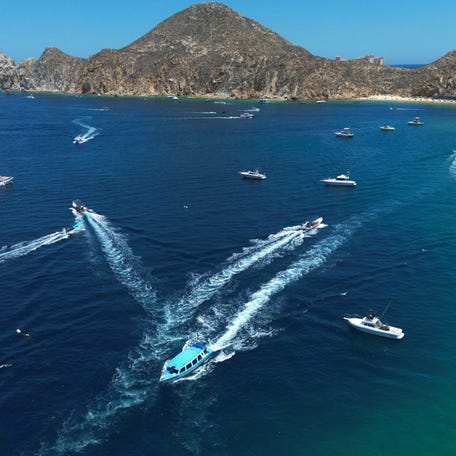 An aerial view of some tourist boats in the Pacific Ocean off Los Cabos, Baja California, Mexico, on July 15, 2025.