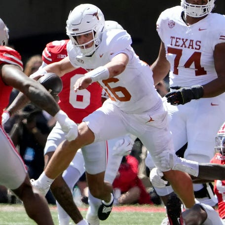 Texas quarterback Arch Manning (16) is tackled by Ohio State linebacker Arvell Reese (8) tackles in the second quarter of their game at Ohio Stadium in Columbus, Ohio on Aug 30, 2025.
