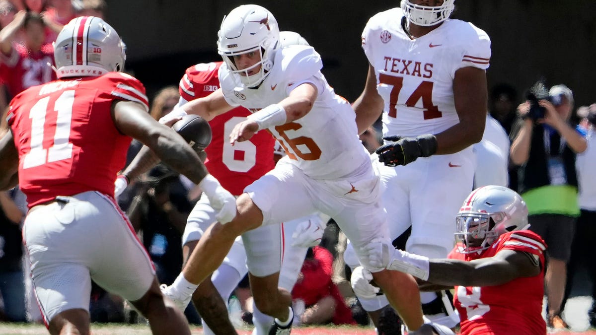 Texas quarterback Arch Manning (16) is tackled by Ohio State linebacker Arvell Reese (8) tackles in the second quarter of their game at Ohio Stadium in Columbus, Ohio on Aug 30, 2025.