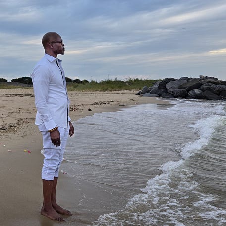 Djimon Hounsou joined others at sunrise Aug. 24, 2025 at Outlook Beach at Fort Monroe in Virginia for the ancestral healing and cleansing ceremony.
