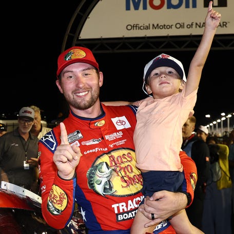Chase Briscoe celebrates with his son Brooks after winning the Cook Out Southern 500 at Darlington Raceway on Aug. 31, 2025.