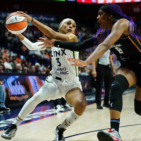 Minnesota Lynx guard DiJonai Carrington (3) drives the ball against Connecticut Sun forward Aaliyah Edwards (8) in the second half at Mohegan Sun Arena in Uncasville, Connecticut on Aug 30, 2025.