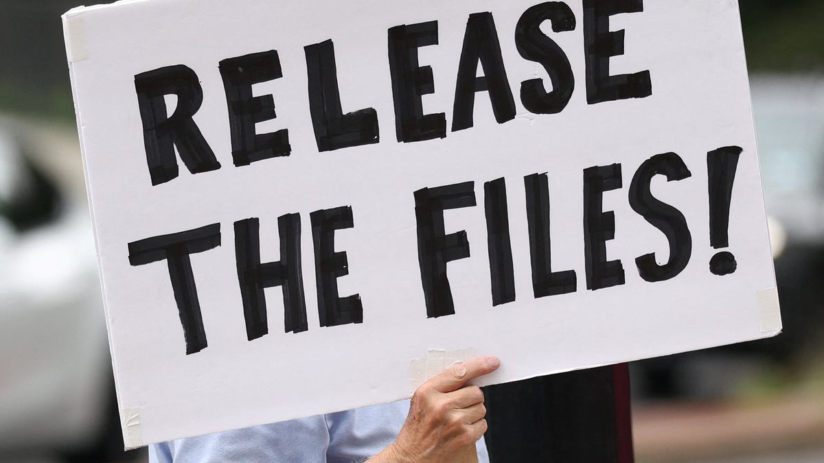 A protester calling for a release of the Epstein files holds a sign while awaiting the potential arrival of Trump administration officials who were expected to discuss strategy amid the deepening political crisis over the administration's handling of files related to convicted sex offender Jeffrey Epstein, at the U.S. Naval Observatory, Vice President JD Vance's official residence, in Washington, D.C., U.S., August 6,   2025.