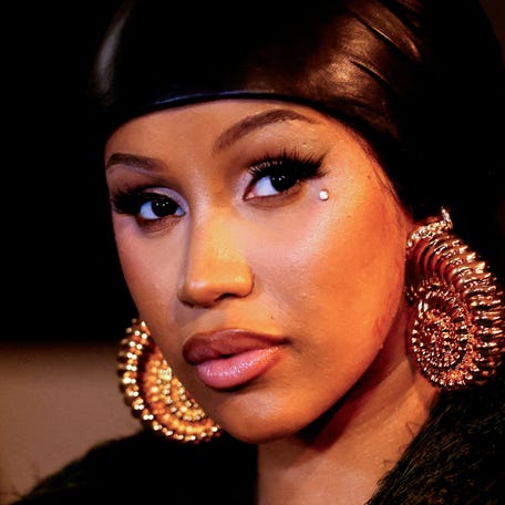 Cardi B looks on during the presentation for fashion house Balmain during Paris Fashion Week in Paris, on Sept. 25, 2024.