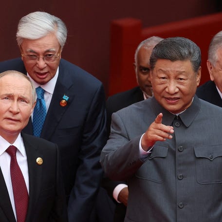 Russian President Vladimir Putin and Chinese President Xi Jinping in the foreground arrive for a military parade marking the 80th anniversary of the end of World War Two, in Beijing, China on Sept. 3, 2025.