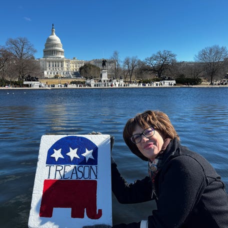 Shelley Feist, 61, protests regularly near the White House. Here she is pictured in Washington, DC, across from the Capitol building.