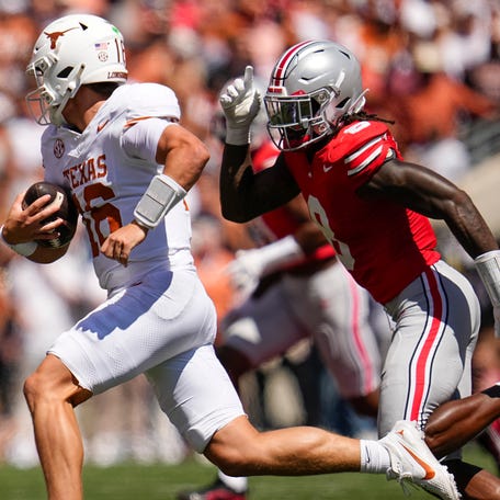 Ohio State Buckeyes linebacker Arvell Reese (8) pursues Texas Longhorns quarterback Arch Manning (16) during the NCAA football game at Ohio Stadium on Aug. 30, 2025.