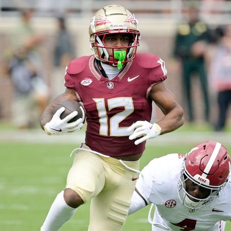 Florida State running back Jaylin Lucas (12) runs with the ball against Alabama during their game at Doak S. Campbell Stadium.