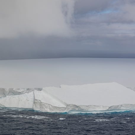 An aerial view of Iceberg A23a during a British Royal Air Force on November 24, 2024 in the South Atlantic Ocean near South Georgia and the South Sandwich Islands. A23a, the world's largest iceberg, broke off (calved) from the Filchner Ice Shelf in Antarctica in 1986, and is now shedding large fragments as it moves into the warmer waters north of Antarctica.