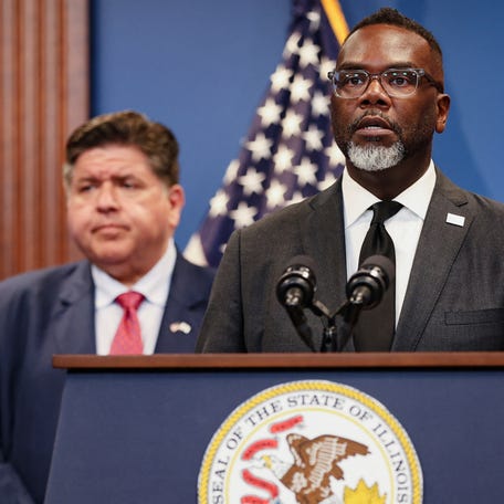 Chicago Mayor Brandon Johnson, in front of Illinois Gov. JB Pritzker, speaks during a press conference on reports of federal deployments in Chicago, Illinois, on Sept. 2, 2025.