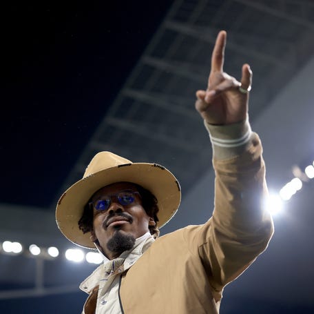 Former NFL quarterback Cam Newton walks on the field at Arena Corinthians before the NFL International Series game between the Kansas City Chiefs and Los Angeles Chargers in São Paulo, Brazil.