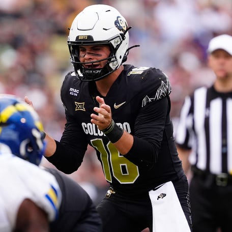 Colorado quarterback Ryan Staub (16) calls for the snap against Delaware during the second half at Folsom Field