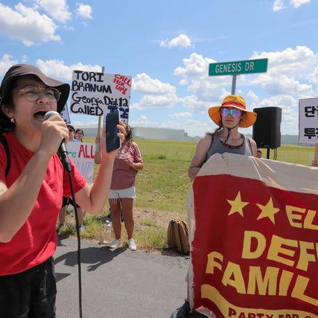 Nat Villasna leads a chant during a protest against ICE outside the Hyundai Metaplant on Saturday, September 6, 2025 in Ellabell Ga.