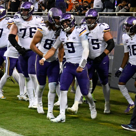 Sep 8, 2025; Chicago, Illinois, USA; Minnesota Vikings quarterback J.J. McCarthy (9) reacts after scoring a touchdown against the Chicago Bears during the second half at Soldier Field. Mandatory Credit: Matt Marton-Imagn Images