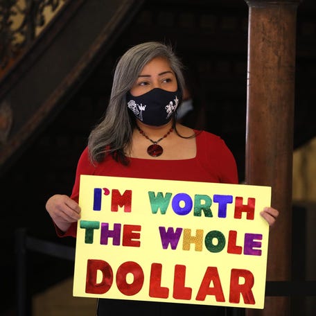 The Pay Equity Coalition of Rochester held a press conference to raise awareness on how Black women get paid less, Jackie Ortiz, co founder of the group and councilmember on the Rochester City Council, holds a sign . At the same press conference held at the Monroe County Office Building, Monroe County Executive Adam Bello announced an executive order that goes into effect immediately, August 13, 2020, that has contractors must follow state and federal equal pay laws and submit an equal pay   certification making sure everyone is paid fairly and also the order states that their will be an internal review on county employees pay.    Jackie Ortiz City Council And Pay Equity