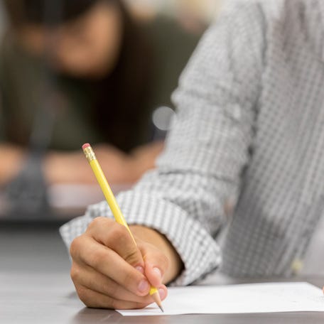 Close up of teenage boy during a test.