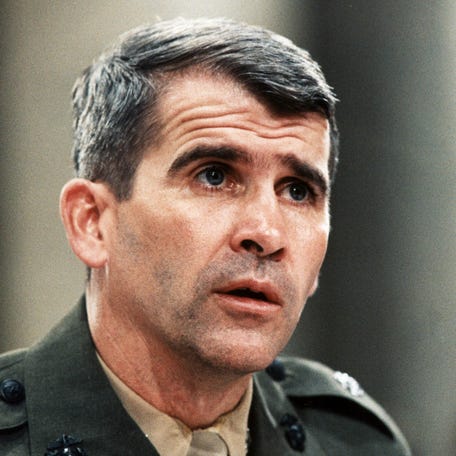 WASHINGTON, DC - JULY 9: Lt. Col. Oliver North, is shown in this file photo, 09 July 1988 during his testimony before the Iran-Contra Committee. He was indicted 16 March 1988 along with former national security advisor John Poindexter by a federal grand jury on conspiracy charges related to the sale of arms to Iran and the diversion of profits to the Nicaraguan Contras. (Photo credit should read FILE/AFP via Getty Images)