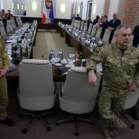 Polish State Fire Service Commander Wojciech Kruczek and General Wieslaw Kukula, chief of the General Staff of the Polish Armed Forces, gather for a meeting after Polish forces shot down drones from its airspace during a Russian attack on Ukraine.