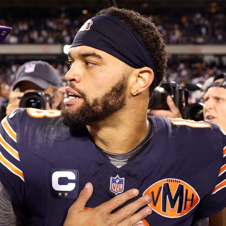 CHICAGO, ILLINOIS - SEPTEMBER 08: J.J. McCarthy #9 of the Minnesota Vikings shakes hands with Caleb Williams #18 of the Chicago Bears after the game at Soldier Field on September 08, 2025 in Chicago, Illinois. (Photo by Michael Reaves/Getty Images)