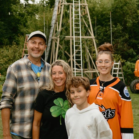 Alex Babich, a landscape gardener from Fort Wayne, Indiana, (far left) and his family who grew the world's tallest sunflower on record, Guinness World Records reported on Sept. 10, 2025.