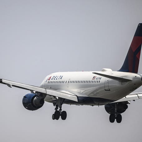 A plane of the US airline Delta approaches for landing at Benito Juarez International Airport in Mexico City on July 22, 2025.
