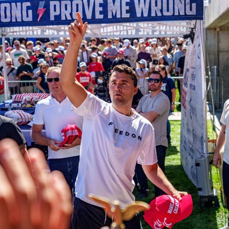 Conservative activist Charlie Kirk is pictured throwing hats to the crowd shortly before he was fatally shot at a Utah Valley University speaking event on Sept. 10.