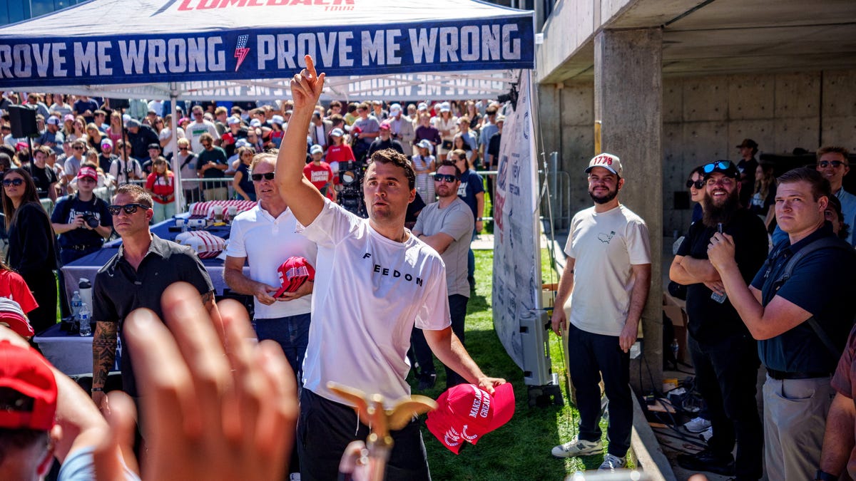 Charlie Kirk throws hats to the crowd shortly before he was shot at a Utah Valley University speaking event in Orem, Utah, Sept. 10, 2025.